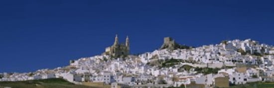 Low angle view of a town Olvera One of the White Villages of Andalucia Cadiz Province Spain Canvas Art - Panoramic Images (36 x 12)