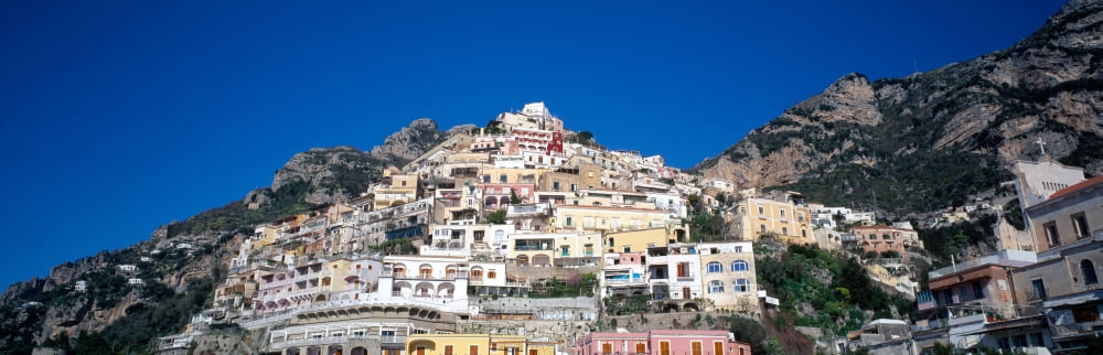 Low angle view of a town on mountains Positano Amalfi Coast Campania Italy Canvas Art - Panoramic Images (12 x 36)