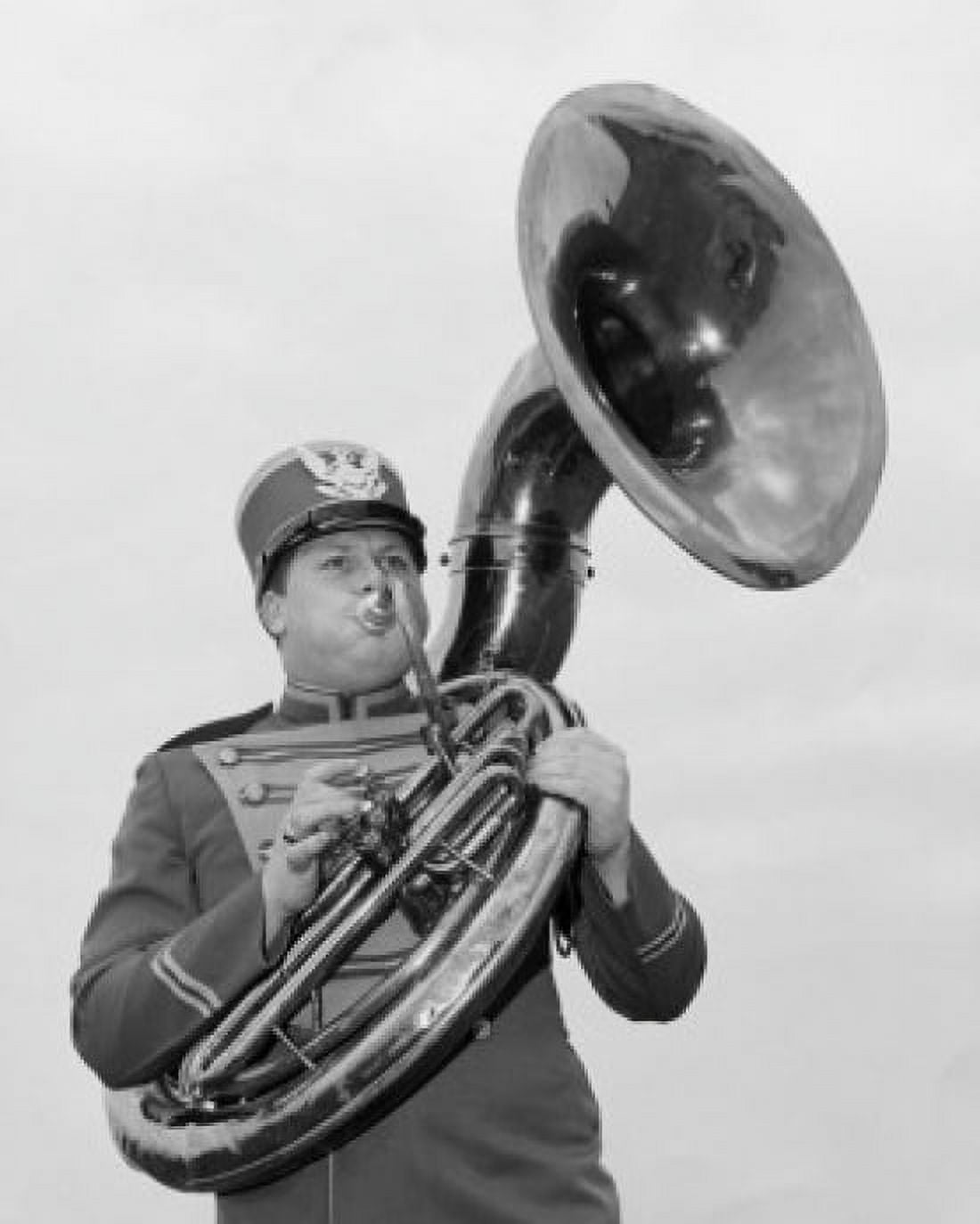 Low angle view of a young man playing the tuba Canvas Art - (18 x 24)