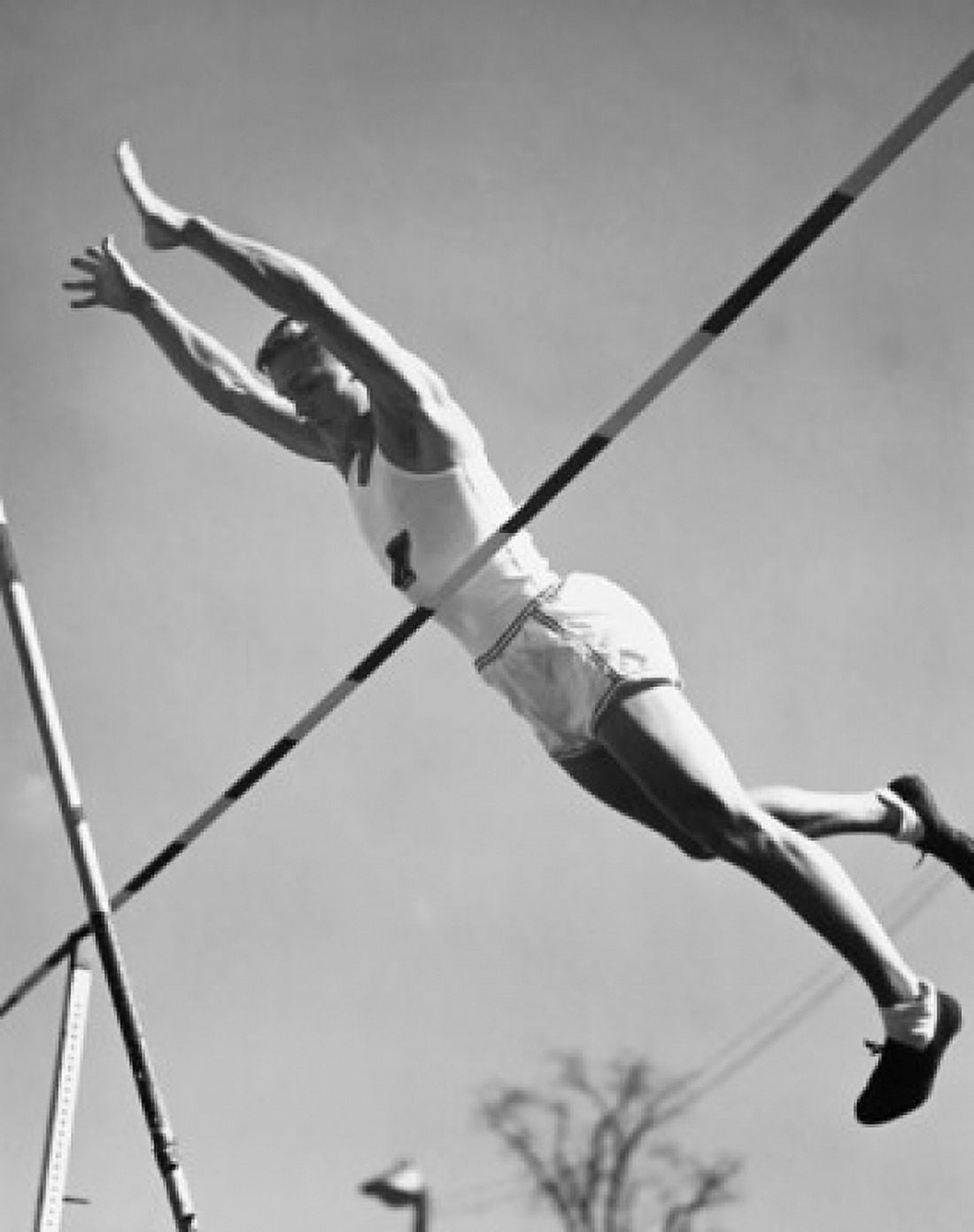 Low angle view of a young man pole vaulting Canvas Art - (18 x 24)