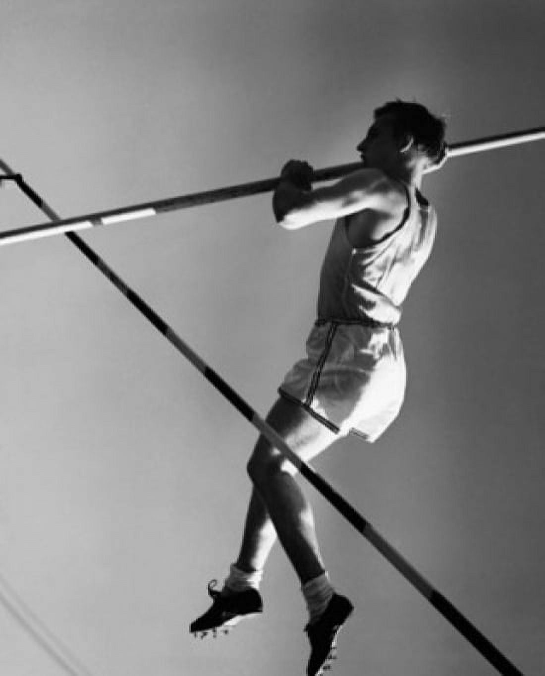 Low angle view of a young man pole vaulting Canvas Art - (24 x 36)