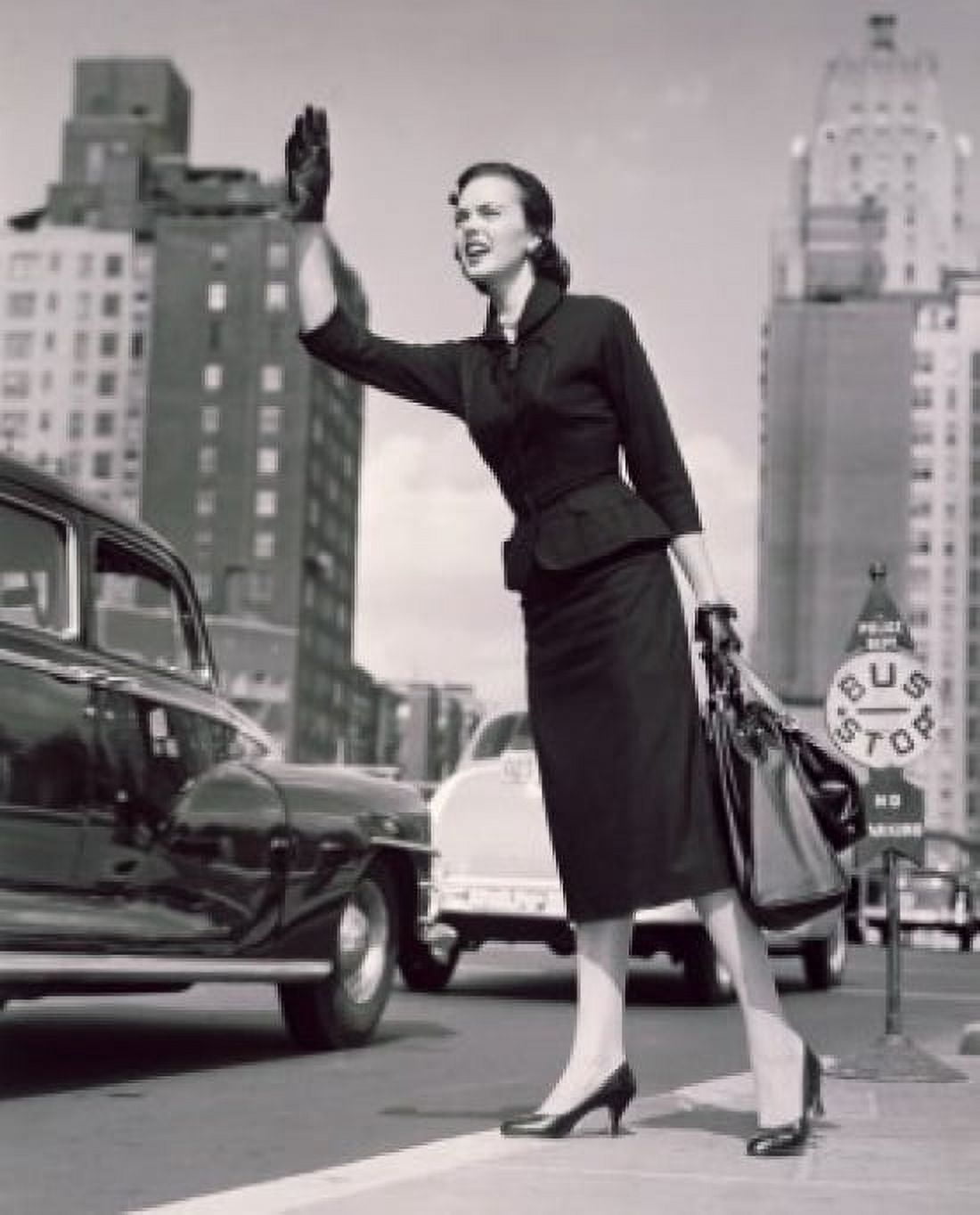 Low angle view of a young woman hailing a taxi Canvas Art - (18 x 24)