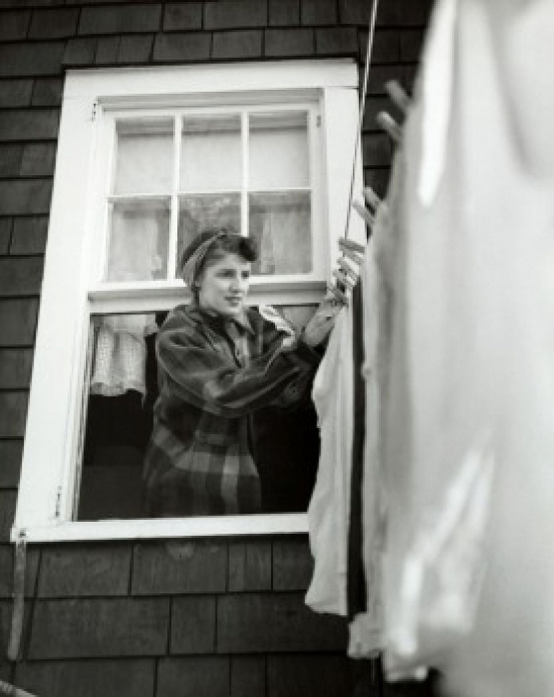 Low angle view of a young woman hanging clothes on a clothesline Canvas Art - (18 x 24)