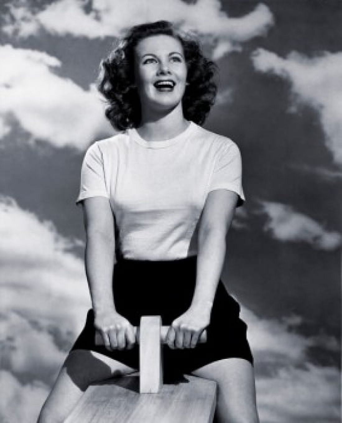 Low angle view of a young woman sitting on a seesaw Canvas Art - (18 x 24)