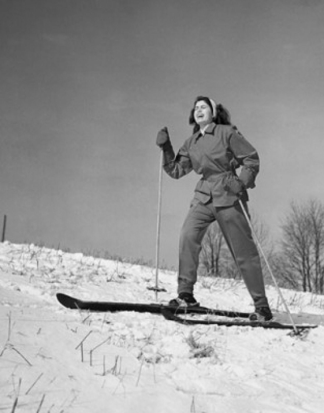 Low angle view of a young woman skiing on snow Canvas Art - (24 x 36)