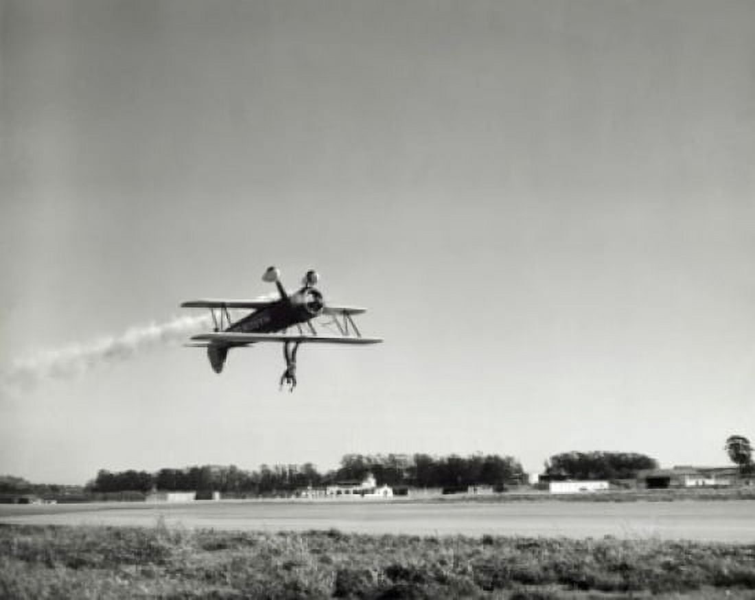 Low angle view of an aircraft upside down in flight with wing walker Canvas Art - (24 x 36)