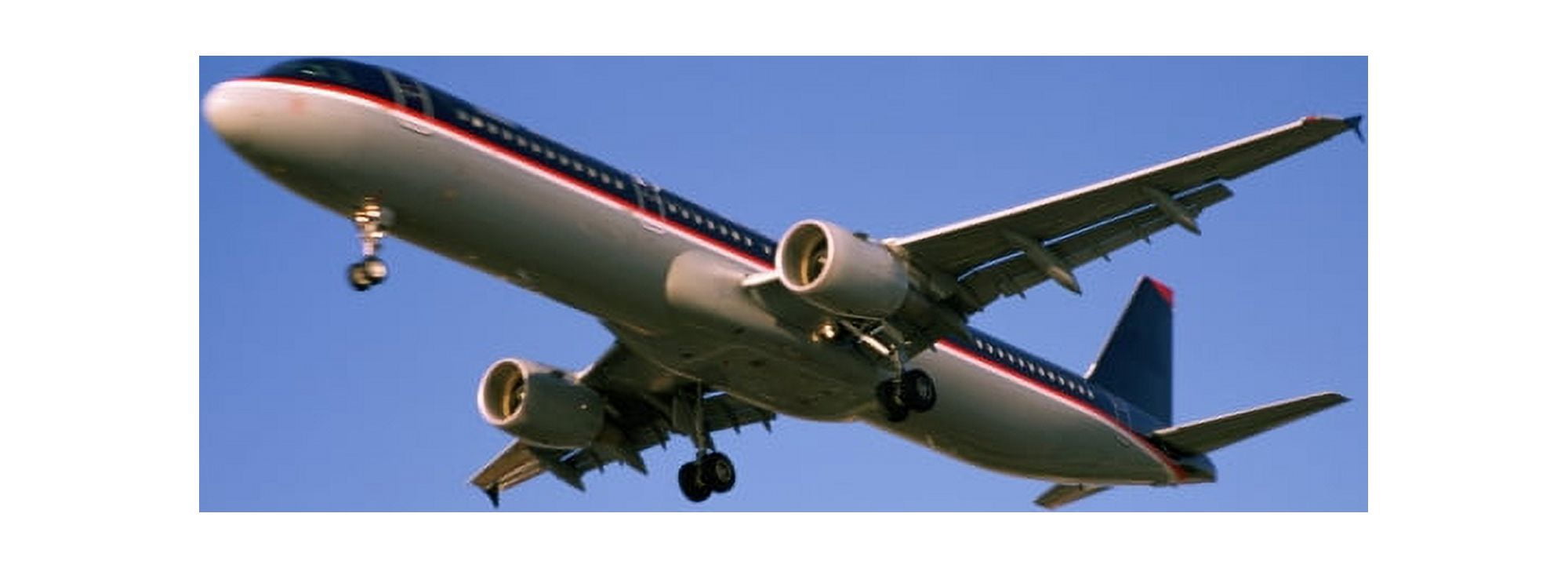 Low angle view of an airplane flying Canvas Art - Panoramic Images (36 x 12)