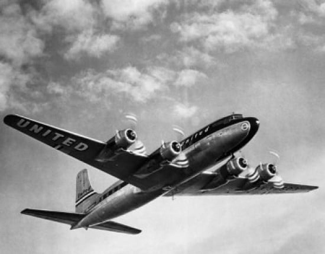 Low angle view of an airplane flying in the sky Canvas Art - (24 x 36)