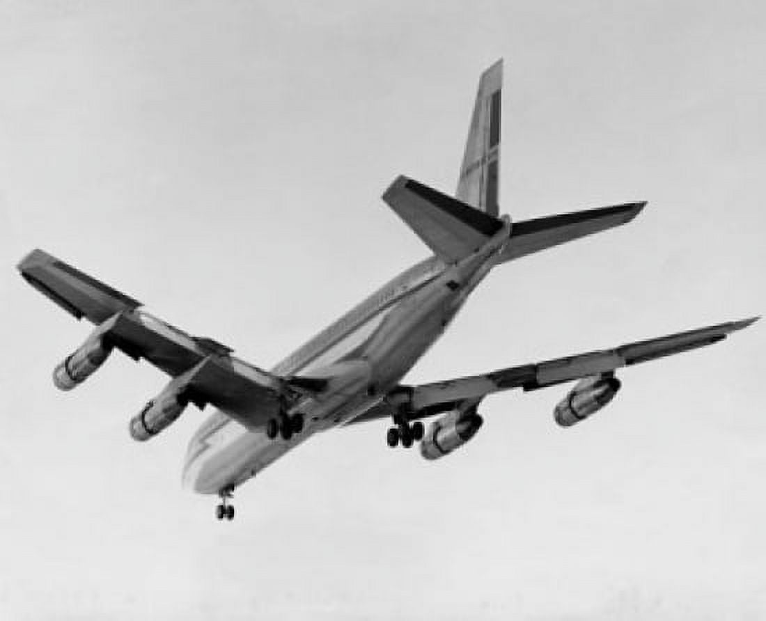 Low angle view of an airplane flying in the sky Canvas Art - (24 x 36)