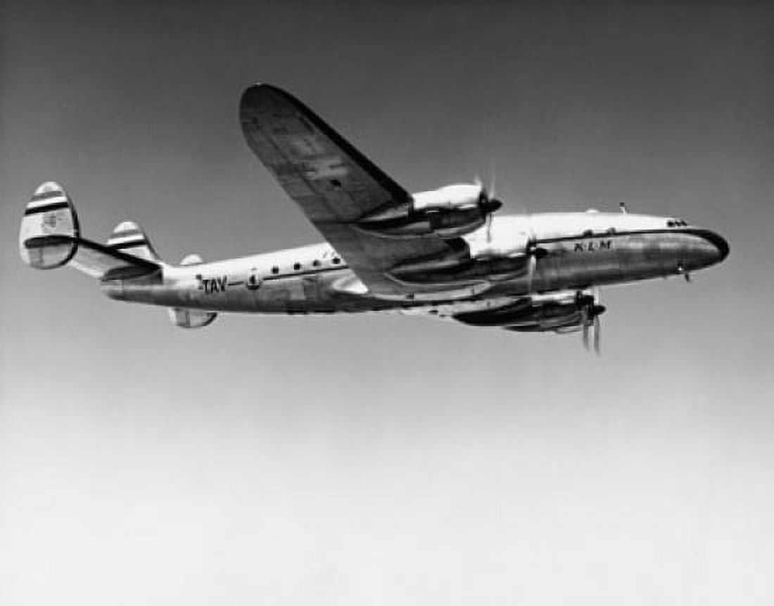 Low angle view of an airplane in flight Canvas Art - (24 x 36)