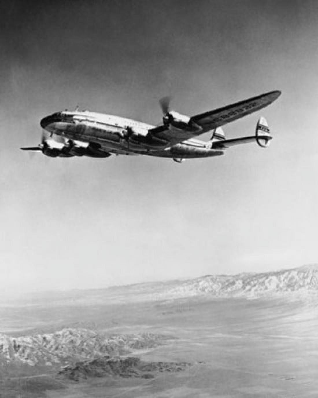 Low angle view of an airplane in flight Pan American World Airways Canvas Art - (18 x 24)