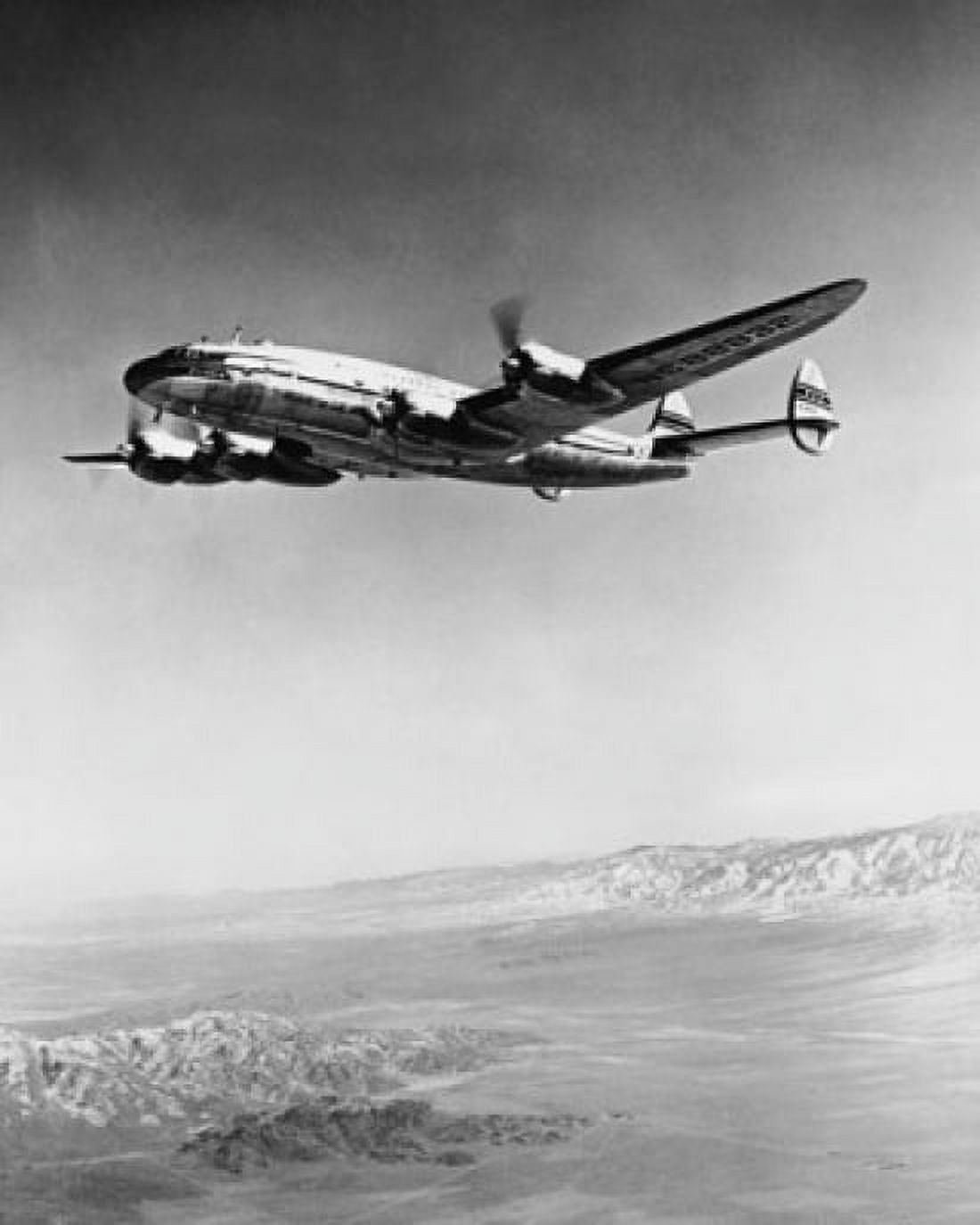 Low angle view of an airplane in flight Pan American World Airways Canvas Art - (24 x 36)