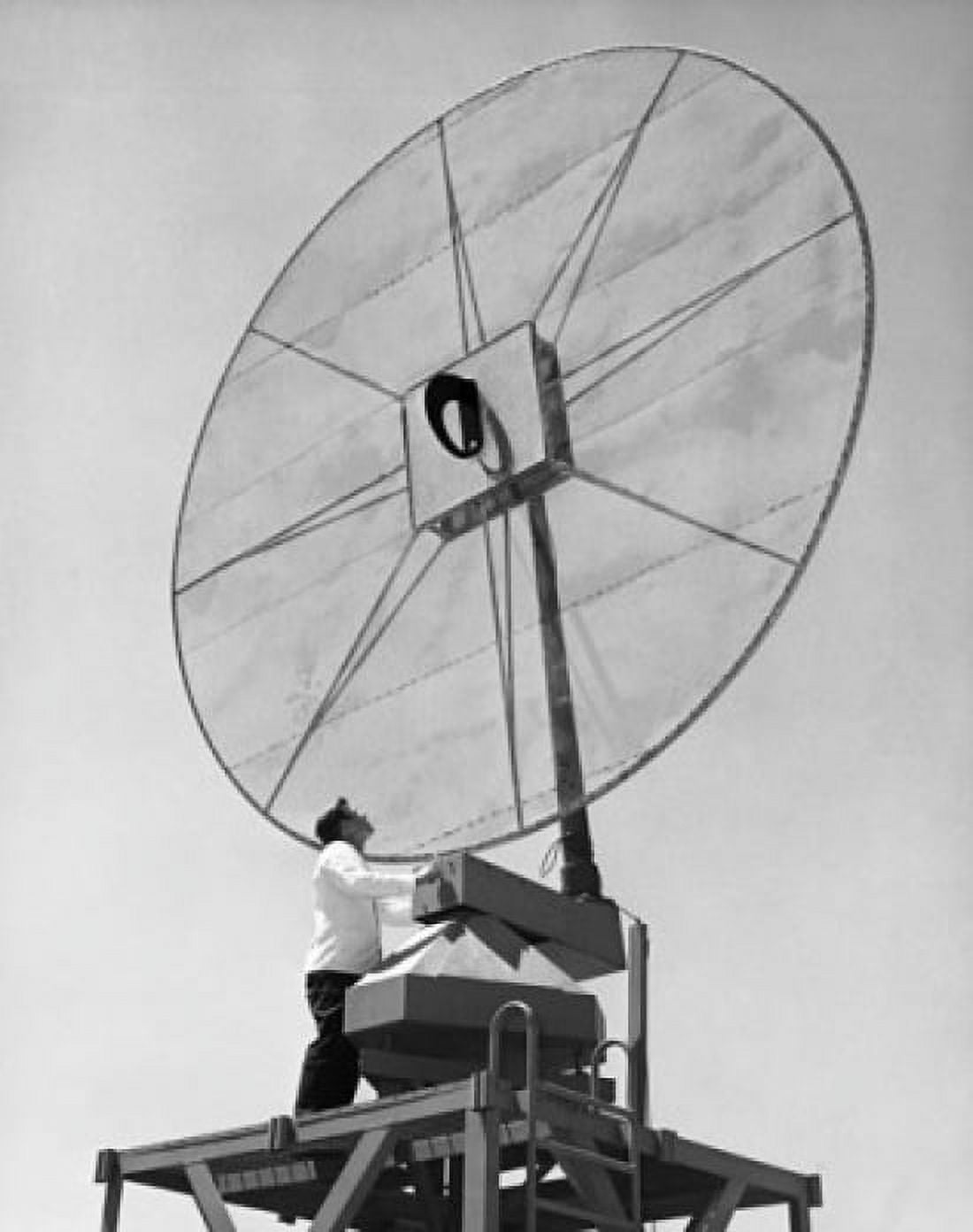 Low angle view of an engineer standing in front of a Scimitar antenna Canvas Art - (18 x 24)
