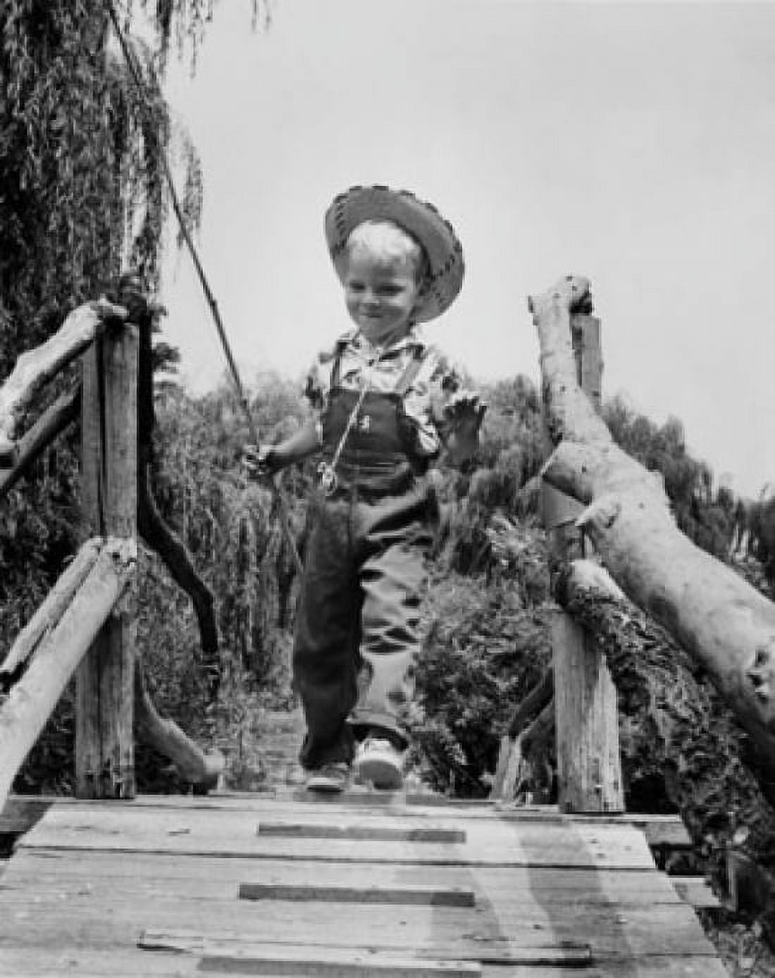 Low angle view of boy walking on footbridge Canvas Art - (18 x 24)