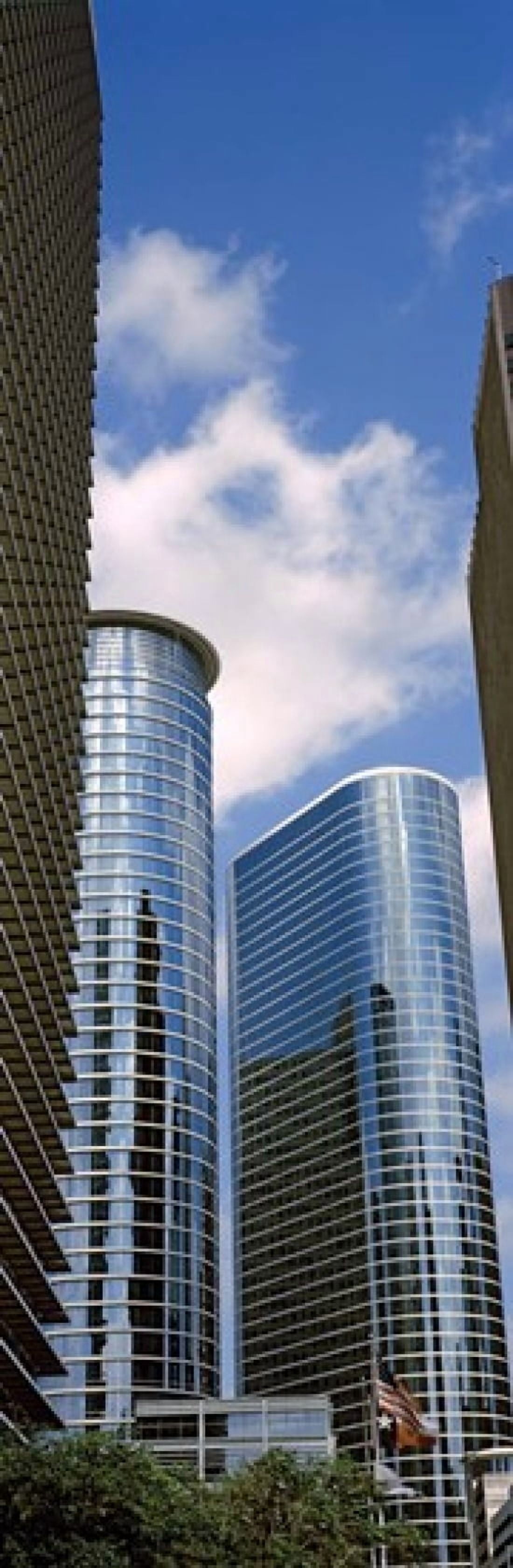 Low angle view of buildings in a city Wedge Tower ExxonMobil Building Chevron Building Houston Texas USA Canvas Art - Panoramic Images (36 x 12)