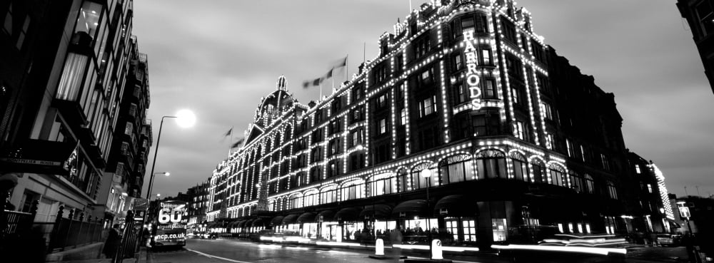Low angle view of buildings lit up at night Harrods London England Canvas Art - Panoramic Images (7 x 18)
