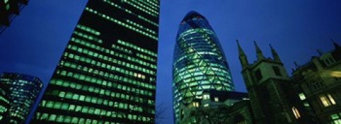 Low angle view of buildings lit up at night Sir Norman Foster Building Swiss Re Tower London England Canvas Art - Panoramic Images (18 x 7)