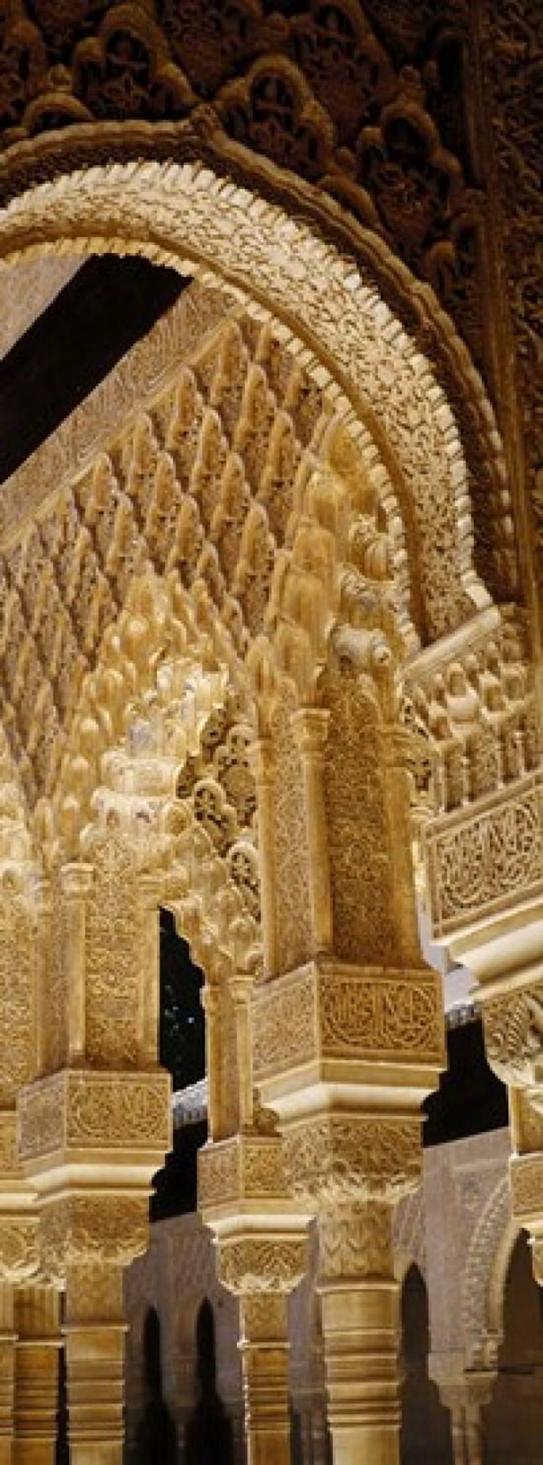 Low angle view of carving on arches and columns of a palace Court Of Lions Alhambra Granada Andalusia Spain Canvas Art - Panoramic Images (18 x 7)