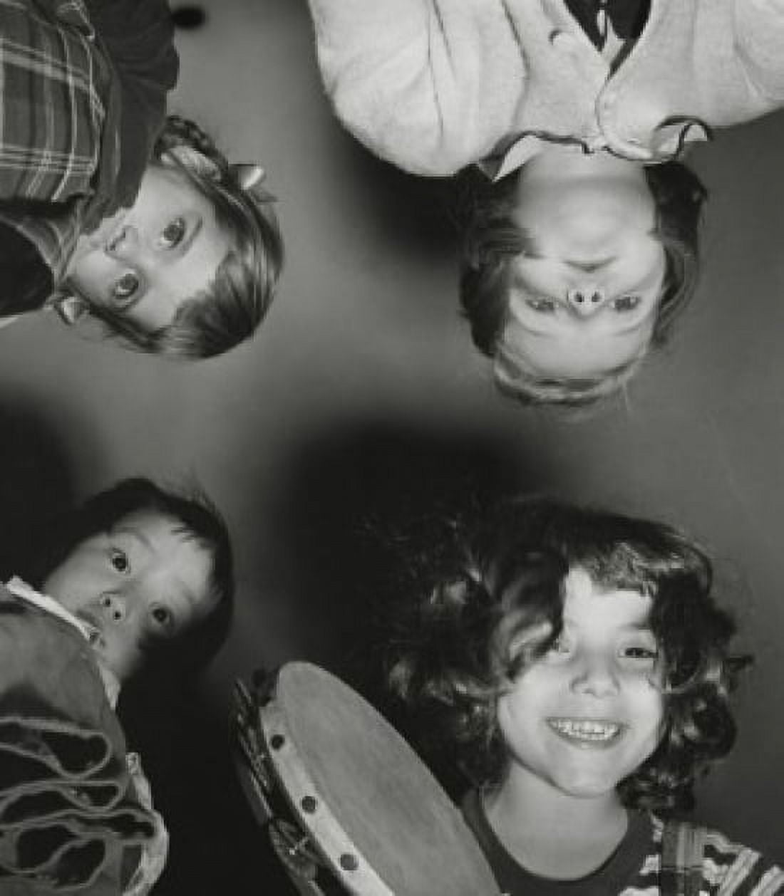 Low angle view of children holding a tambourine Canvas Art - (18 x 24)