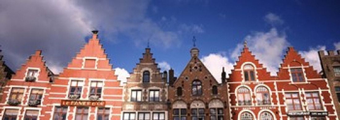 Low angle view of colorful buildings Main Square Bruges West Flanders Flemish Region Belgium Canvas Art - Panoramic Images (18 x 7)