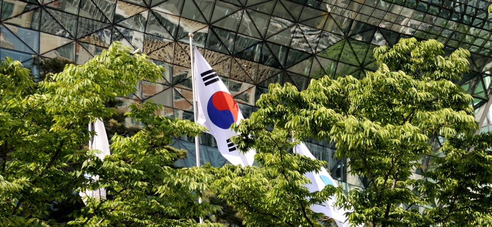 Low angle view of flags and trees in front of Seoul City Hall Seoul City Hall Seoul South Korea Canvas Art - Panoramic Images (36 x 12)