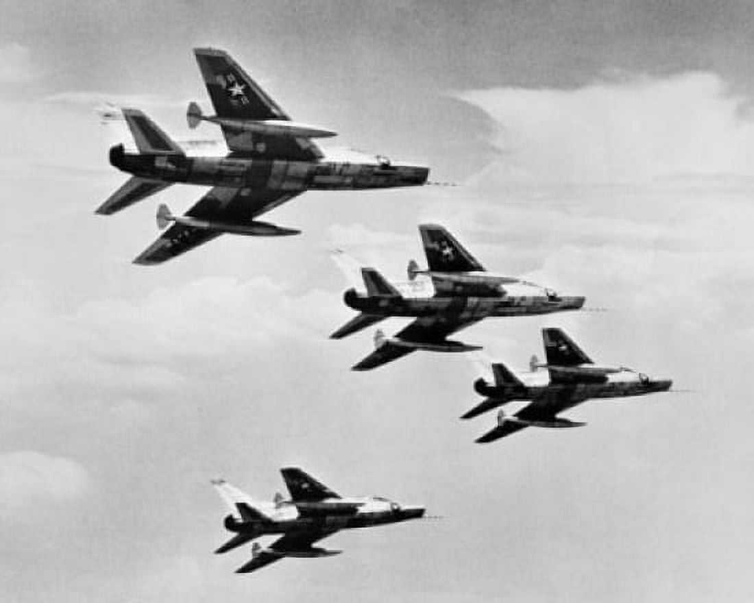 Low angle view of four fighter planes flying in formation F-100 Super Sabre Canvas Art - (18 x 24)