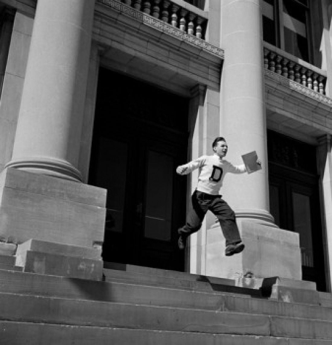 Low angle view of man rushing out building Canvas Art - (18 x 24)
