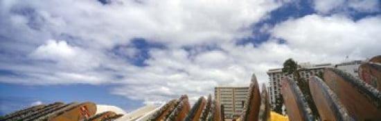 Low angle view of skyscrapers and surfboards Honolulu Oahu Hawaii USA Canvas Art - Panoramic Images (36 x 12)