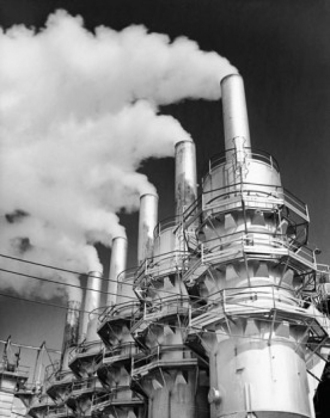 Low angle view of smoke emerging from smoke stacks Canvas Art -  (24 x 36)
