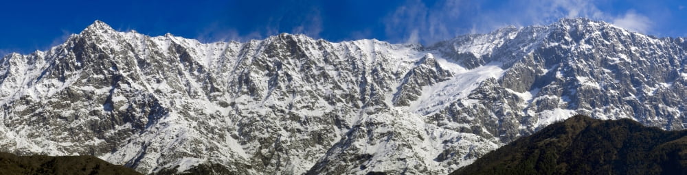 Low angle view of the Dhauladhar mountain range from Lower Dharamsala Himachal Pradesh India Canvas Art - Panoramic Images (47 x 12)