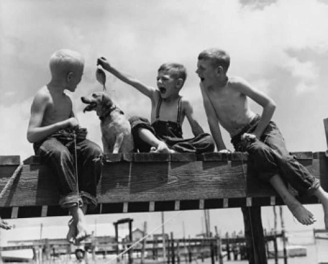 Low angle view of three boys fishing Canvas Art - (24 x 36)