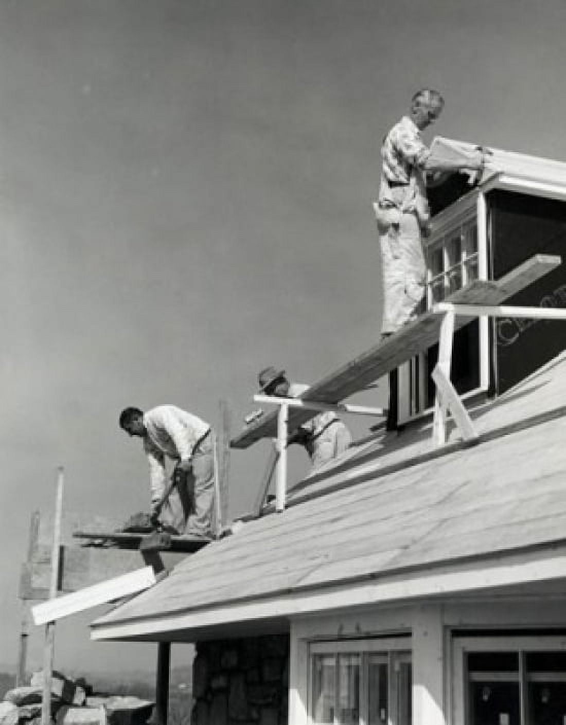 Low angle view of three workers building a house Canvas Art - (24 x 36)
