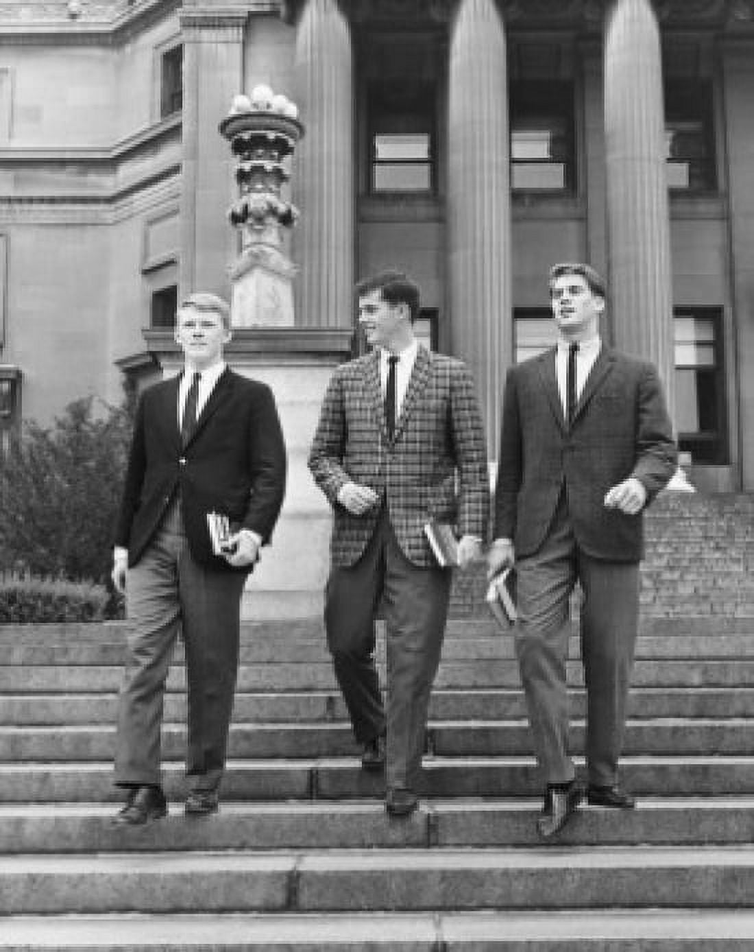 Low angle view of three young men walking down steps Canvas Art - (18 x 24)