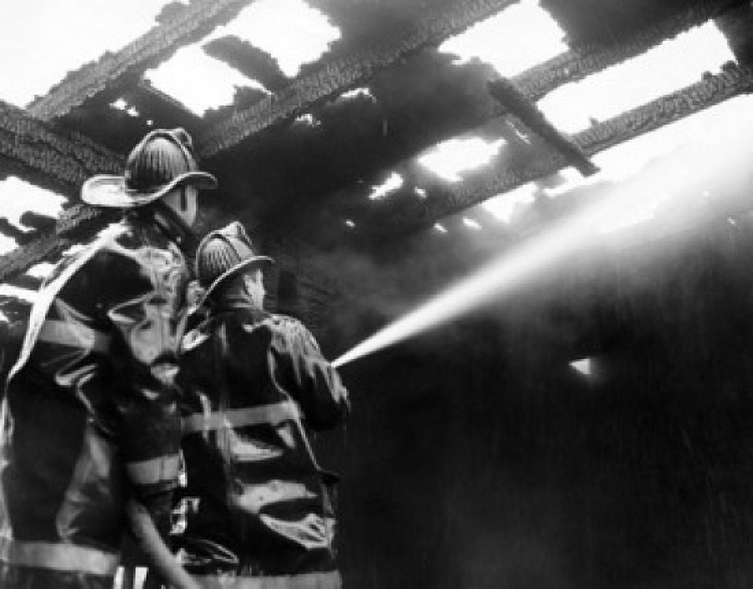Low angle view of two firemen spraying water on a burning building Canvas Art - (18 x 24)