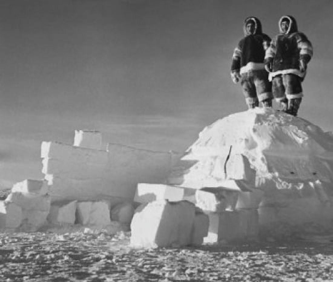 Low angle view of two men standing on an igloo Canvas Art - (18 x 24)