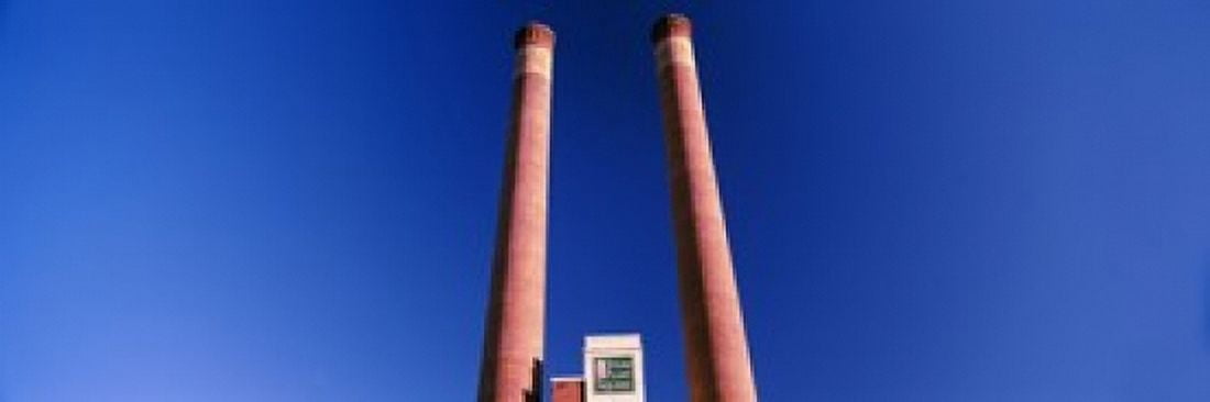 Low angle view of two smoke stacks at Steam Plant Square Spokane Washington State USA Canvas Art - Panoramic Images (18 x 6)