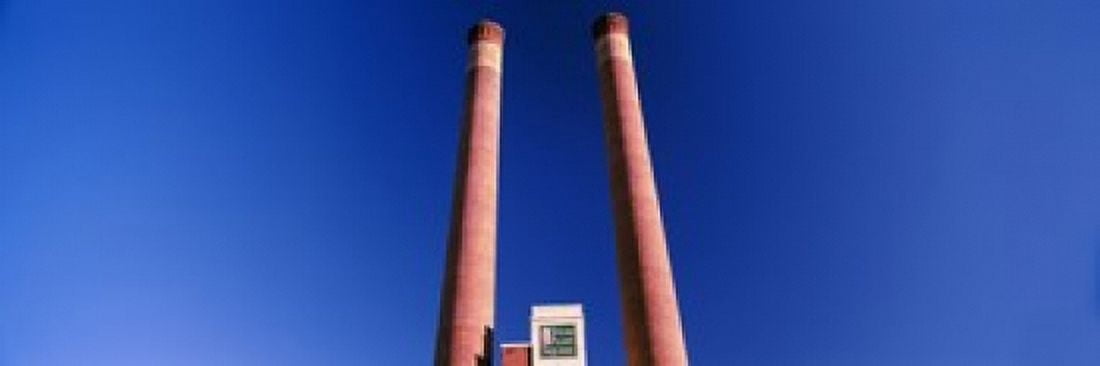 Low angle view of two smoke stacks at Steam Plant Square Spokane Washington State USA Canvas Art - Panoramic Images (36 x 12)