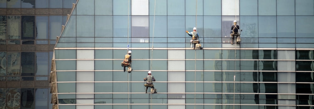 Low angle view of window washer cleaning office building Seoul South Korea Canvas Art - Panoramic Images (9 x 27)