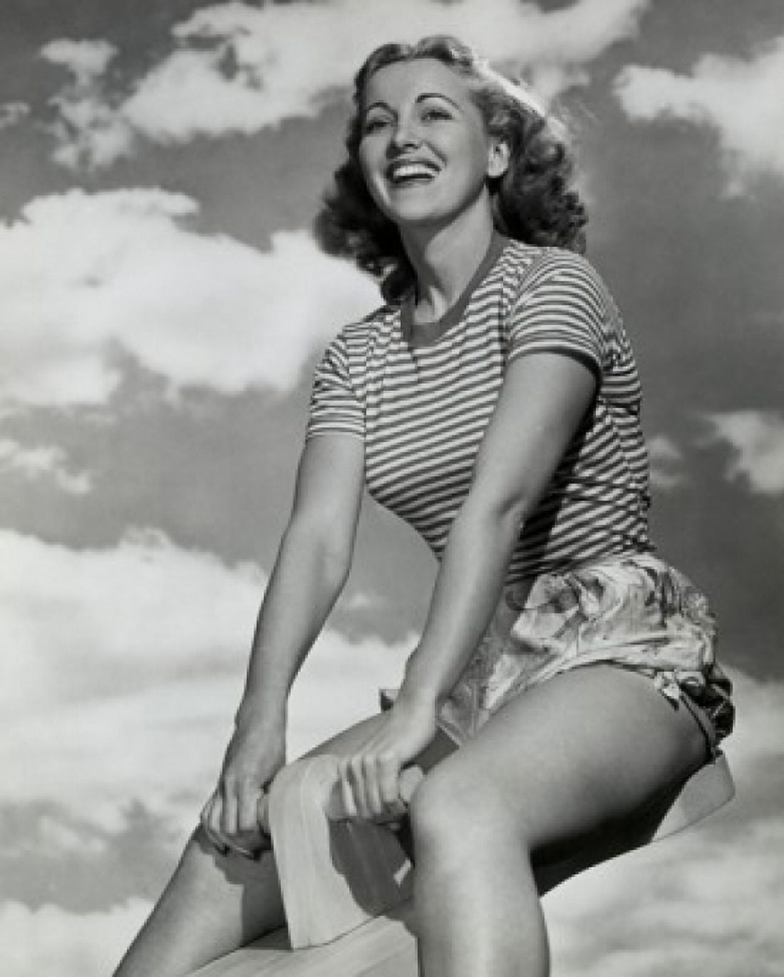 Low angle view of young woman sitting on seesaw Canvas Art - (18 x 24)