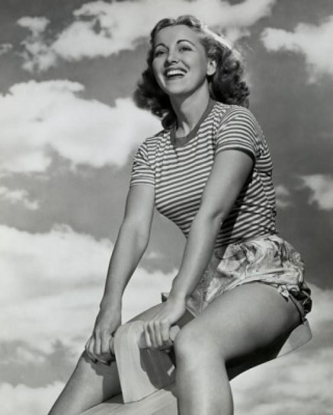 Low angle view of young woman sitting on seesaw Canvas Art - (24 x 36)