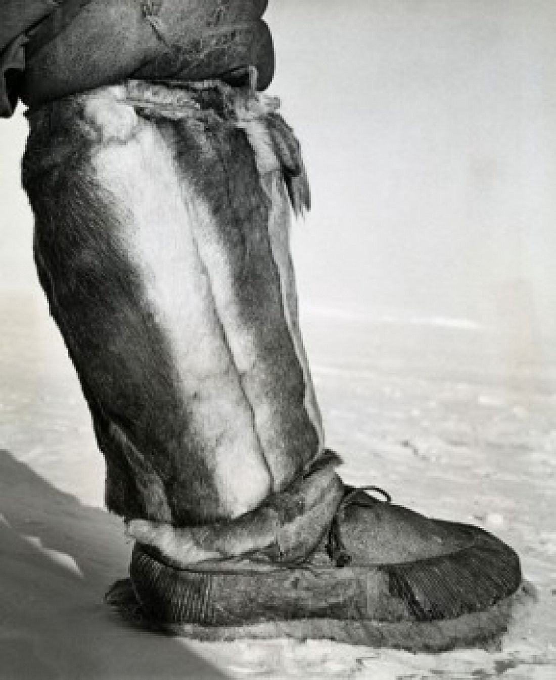 Low section view of a person wearing a kamik over his mukluk Canvas Art -  (18 x 24)