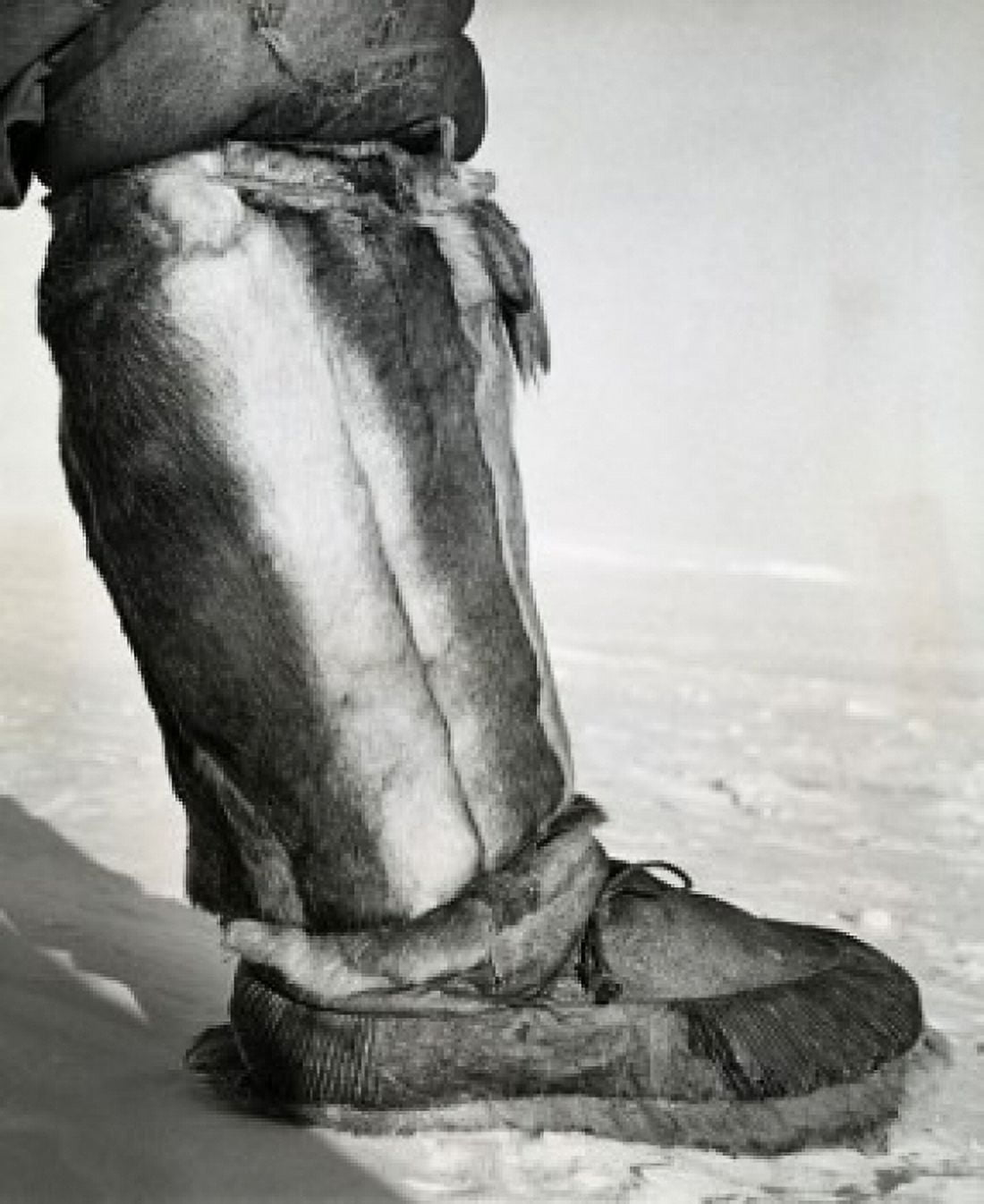 Low section view of a person wearing a kamik over his mukluk Canvas Art - (24 x 36)
