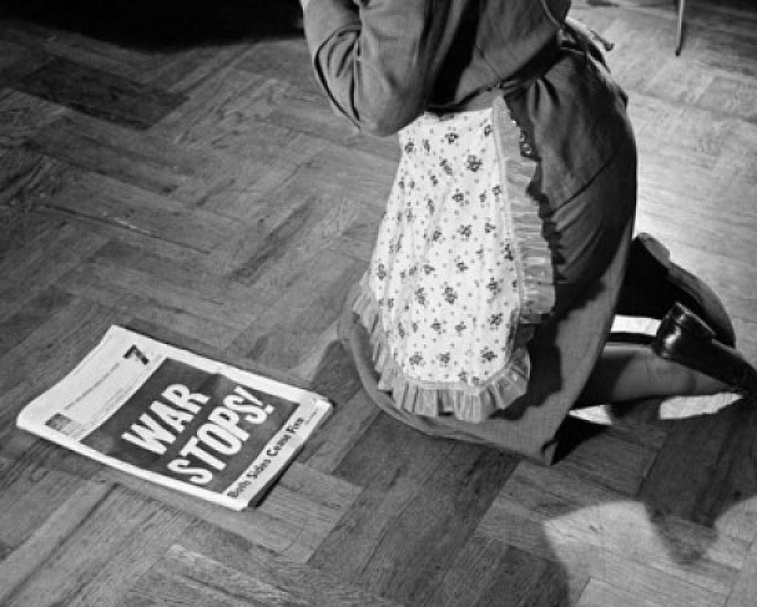Low section view of a woman kneeling near a newspaper Canvas Art - (18 x 24)