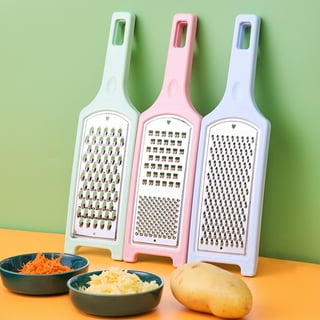 Premium Photo  Vegetable and cheese grater on a pink festive background