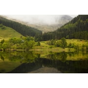 Lush green landscape with grass trees and low cloud with its mirror image in the tranquil water Scotland Canvas Art - John Short Design Pics 19 x 12