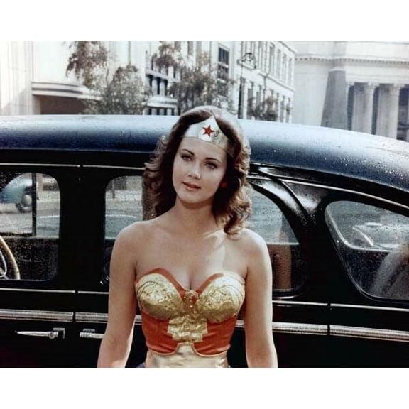 Lynda Carter as Wonder Woman standing in front of 1940's car 16x20 inch Poster
