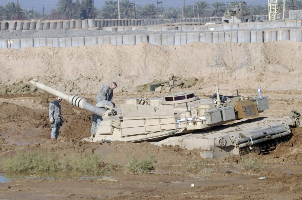 M1 Abrams tank is bogged when trying to cross wet area at the end of Camp Warhorses small runway Canvas Art - Terry MooreStocktrek Images (35 x 23)
