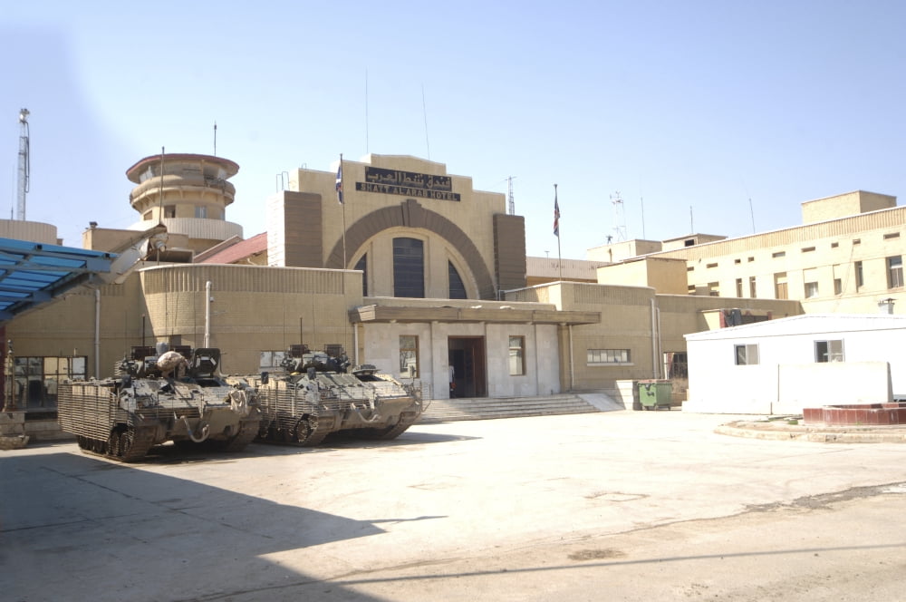 MCV-80 Warrior vehicles parked outside headquarters in Iraq Canvas Art - Andrew ChittockStocktrek Images (34 x 23)