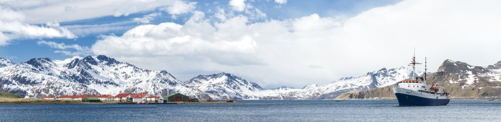 MV Ushuaia tourist ship and the British base King Edward Point seen from Grytviken South Georgia Island Canvas Art - Panoramic Images (27 x 9)