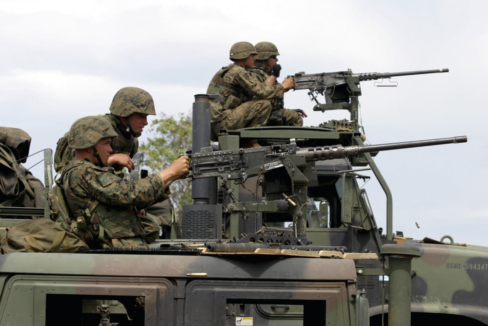 Machine gunners fire machine guns from atop of Light Armored Vehicles Canvas Art - Stocktrek Images (34 x 23)